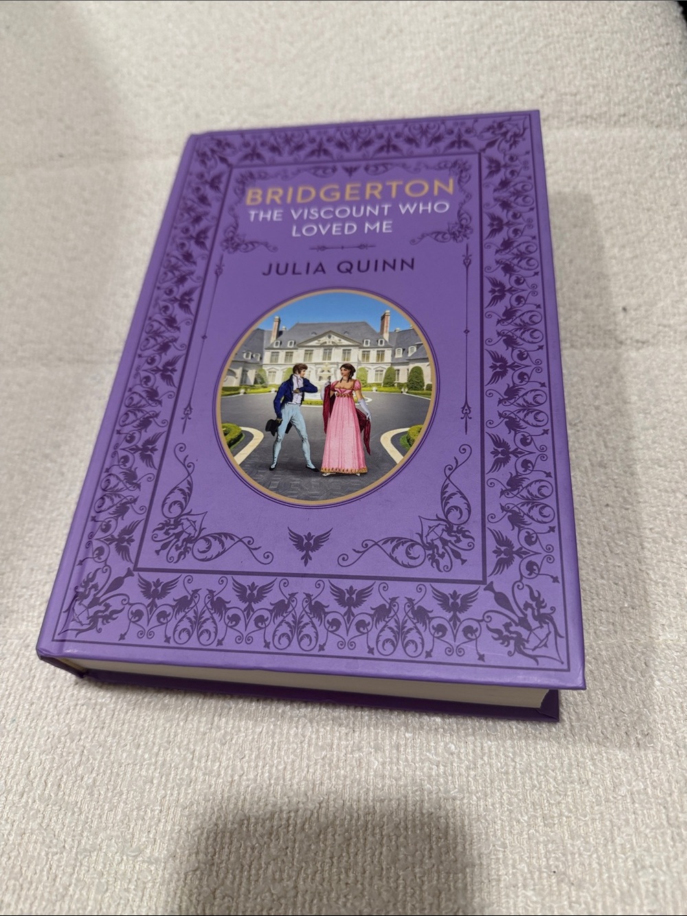 Purple Hardcover Novel with Ornate Floral Embossing